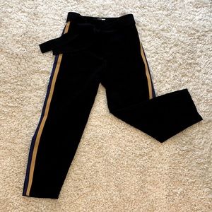 Black Wilfred Dress Pants from Aritzia with navy blue and yellow stripes.